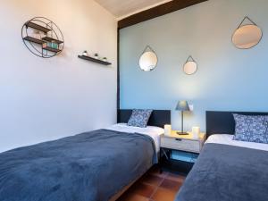 Postel nebo postele na pokoji v ubytování Holiday Home Poste by Interhome
