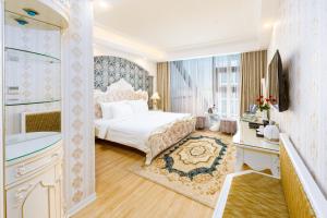 Postel nebo postele na pokoji v ubytování Golden Rose Hotel