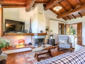 A television and/or entertainment centre at Holiday Home Le Bore - CNG122 by Interhome