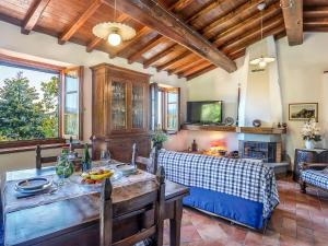 A television and/or entertainment centre at Holiday Home Le Bore - CNG122 by Interhome