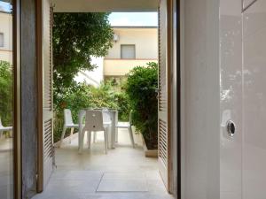 an internal view of a balcony with a table and chairs at Apartment Sea Design Home by Interhome in Viareggio