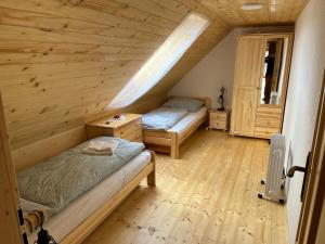 A bed or beds in a room at Chalupa v prírode