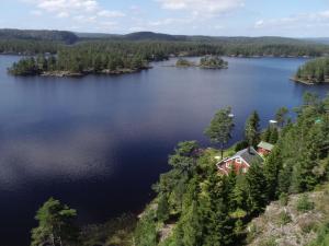 an aerial view of a lake with a house at Holiday Home Ogge by Interhome in Svaland