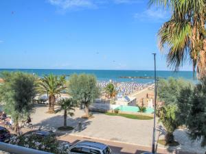 a view of a beach with a crowd of people at Apartment Cala Luna-1 by Interhome in Porto dʼAscoli