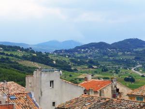 a view of a town with mountains in the background at Holiday Home La Cadièrienne by Interhome in La Cadière-dʼAzur