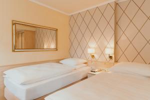 Voodi või voodid majutusasutuse Hotel Scherer toas