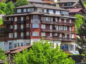 a large building with a british sign on it at Apartment Bristol-2 by Interhome in Wengen