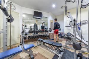 a man standing in a room with a lot of equipment at Hotel Punta in Vodice