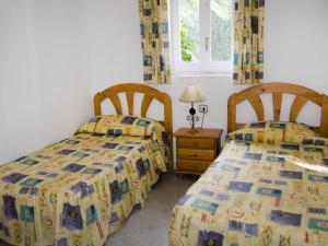 Cama ou camas em um quarto em Apartment Masia Torrents 5 by Interhome