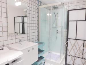 a bathroom with a shower and a sink at Apartment Saint Thomas by Interhome in Saint Malo