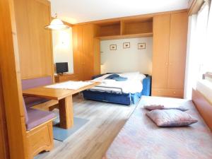 Posteľ alebo postele v izbe v ubytovaní Ski Residence