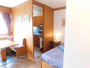Posteľ alebo postele v izbe v ubytovaní Ski Residence