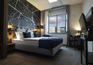 Postel nebo postele na pokoji v ubytování Best Western Hotel Mariacki Katowice