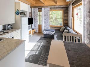 a kitchen and living room in a tiny house at Holiday Home Kukasrakka c10 by Interhome in Äkäslompolo