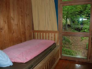 Postel nebo postele na pokoji v ubytování Holiday Home Bosco-TICINO TICKET Inklusive!-4 by Interhome
