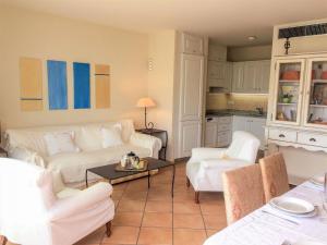 a living room with two white couches and a table at Apartment Le Panoramic by Interhome in Sainte-Maxime