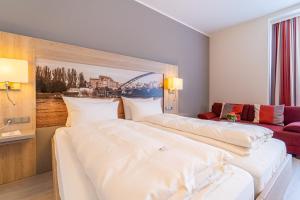 Postel nebo postele na pokoji v ubytování Best Western Hotel Dreiländerbrücke Weil am Rhein / Basel