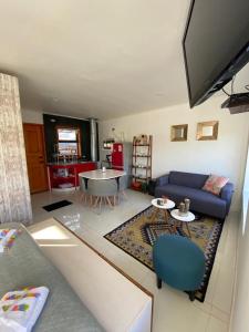 a living room with a couch and a table at Departamentos KM 5 in Coihaique