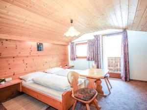 A bed or beds in a room at Holiday Home Hölzl by Interhome
