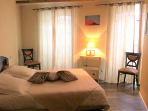 Ένα ή περισσότερα κρεβάτια σε δωμάτιο στο La Terrasse