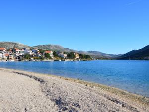 a body of water with a town in the background at Apartment Miro-1 by Interhome in Grebaštica