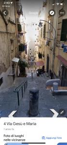 an empty alley with benches in a city at I Gradini dell Eden in Naples