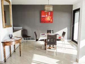 a dining room with a table and chairs at Apartment Les Hauts de Fonsainte by Interhome in La Ciotat