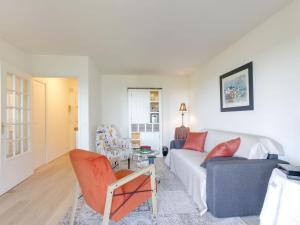 a living room with a couch and a table at Studio Les Corniches du Mont Canisy-3 by Interhome in Blonville-sur-Mer