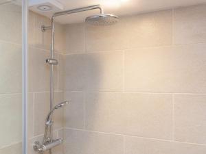 a shower with a glass door in a bathroom at Hepworth Apartment in St Ives +11 photos