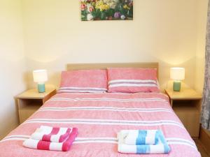 a bedroom with a bed with two pillows on it at Clash-Brack in Dungarvan