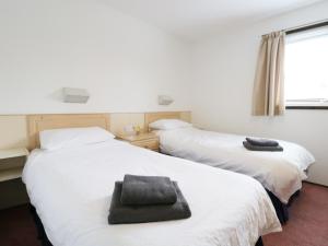 Ένα ή περισσότερα κρεβάτια σε δωμάτιο στο Hope Lodge