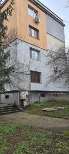 a building with a staircase in front of it at ЗАРА in Ruse