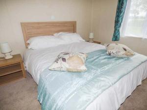 Ένα ή περισσότερα κρεβάτια σε δωμάτιο στο Whorlton Lodge