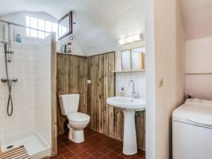 a bathroom with a toilet and a sink and a shower at Holiday Home Les Huppes by Interhome in Saint-Saturnin-les-Apt