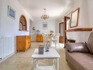 a living room with a couch and a table at Holiday Home Peeters by Interhome in Calpe