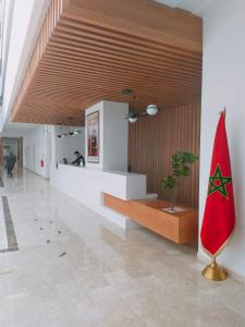 a lobby with a red surfboard in a building at Zephyr Agadir in Agadir +37 photos
