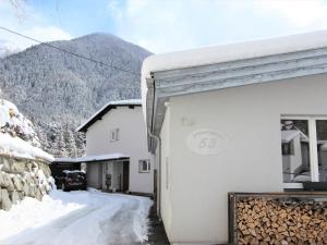 a building with snow on the side of it at Apartment Isolde by Interhome in Reith bei Seefeld