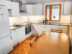 A kitchen or kitchenette at Holiday Home Kotimäki by Interhome