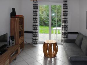 a living room with a couch and a coffee table at Apartment Gollwitzer Park - Insel Poel-9 by Interhome in Gollwitz