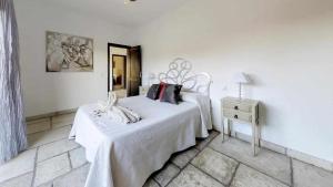 Posteľ alebo postele v izbe v ubytovaní Anju Villas Villas Vistas del Mar