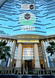 a large building with a sign on top of it at Midan Hotel & Suites Al Aziziya in Mecca