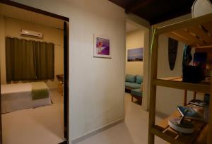 a bedroom with a bunk bed and a bunk room with a bunk bed at Tiny House Noronha in Fernando de Noronha