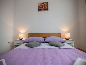 Postel nebo postele na pokoji v ubytování Apartments & Rooms Rendulić + 21 fotografií