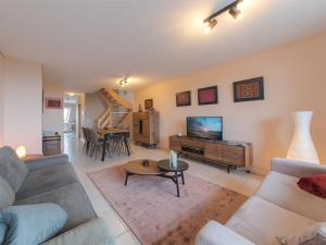 TV a/nebo společenská místnost v ubytování Apartment Meiboom 503 by Interhome