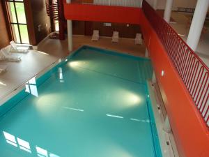 an overhead view of a swimming pool in a building at Apartment Albarella Panorama by Interhome in San Bernardino