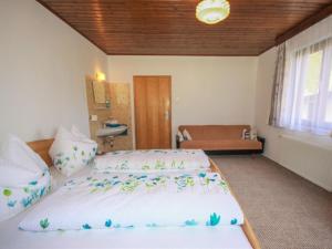 A bed or beds in a room at Holiday Home Martina by Interhome