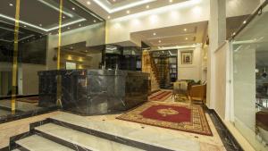 a lobby with a large marble exhibit in a building at Hotel de paris in Casablanca
