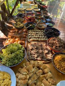 a table filled with lots of different types of food at Turan Hill Lounge in Faralya