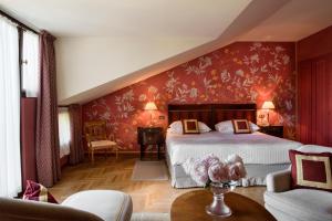 En eller flere senge i et værelse på Hotel Villa Cipriani