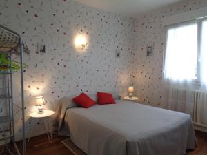 Ένα ή περισσότερα κρεβάτια σε δωμάτιο στο chambre d'hôte
